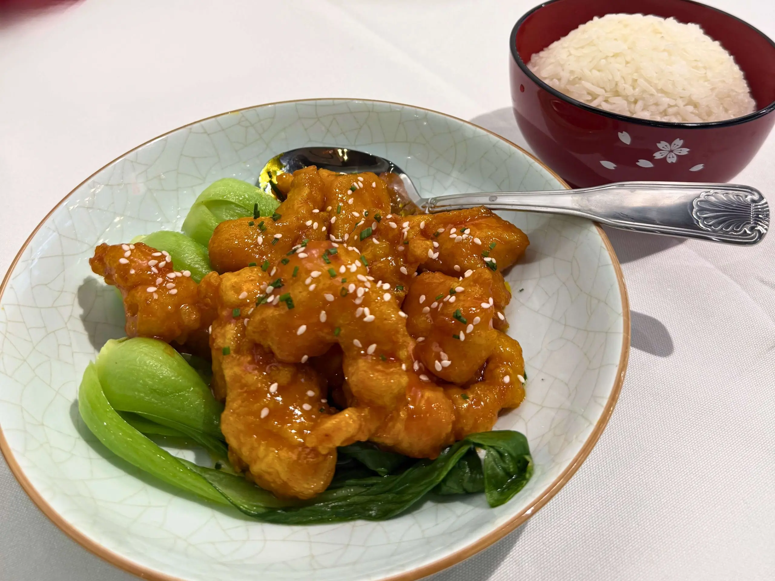 Crispy sesame chicken with bok choy at Big 8, a Chinese Restaurant in Lincoln